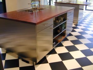 stainless steel cabinetry for a kitchen island with a wide plank wood countertop