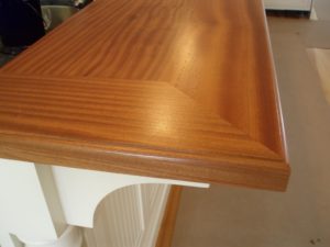 wide plank mahogany wood bar top and rails