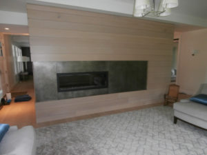 transitional living room wiht patina zinc fireplace surround