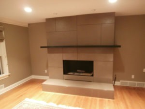 paneled engineered concrete fireplace surround