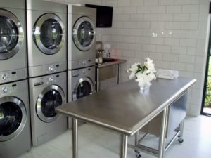 laundry room with custom stainless steel cabinets