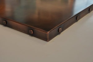 copper counter top, copper countertop with patina finish and matching rivets