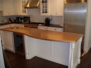 copper counter top, copper countertop with curved front overhang on a kitchen island