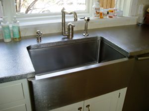 farm sink cutout, stainless steel countertop, machine hammered stainless steel, metal textures