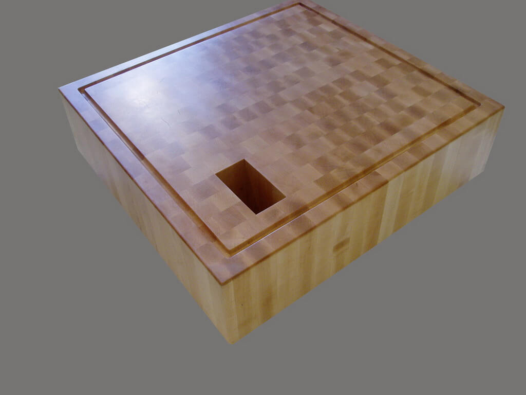 https://brookscustom.com/wp-content/uploads/2016/03/44-Thick-end-grain-maple-butcher-block-with-waste-chute_resize.jpg
