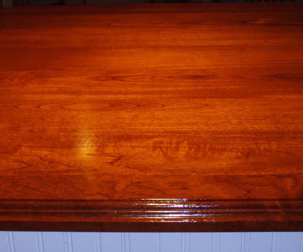2 1/4" thick Brazilian cherry premium wide plank island top. Natural color with a Marine Oil Finish and an ogee-E edge.